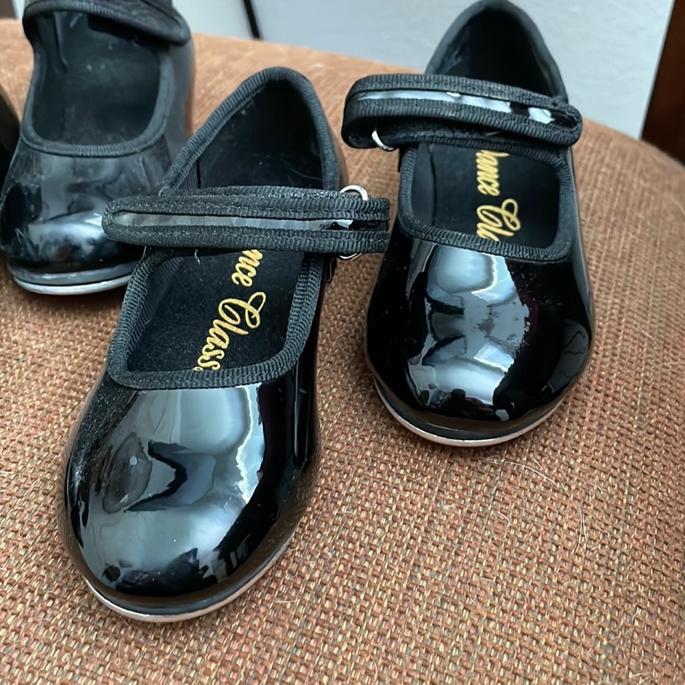 Three sets of tapping shoes.